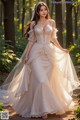 a woman in a wedding dress standing in the woods